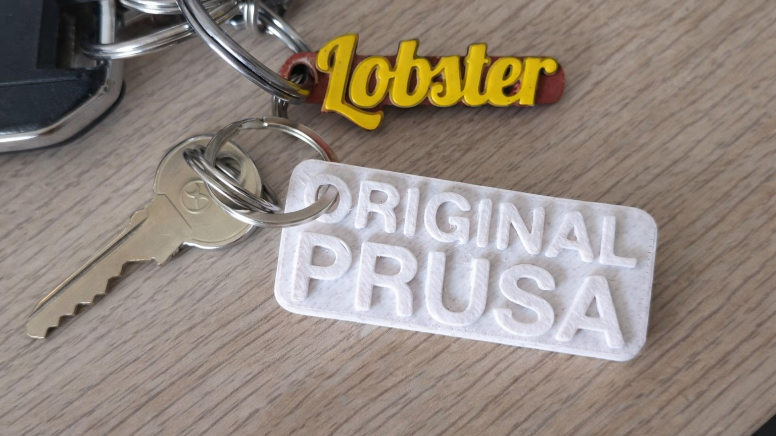 Porte-clés personnalisés imprimés en 3D avec logo et texte en relief, fabrication sur mesure